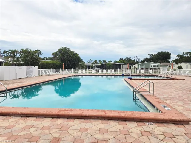 Community pool with a patio area