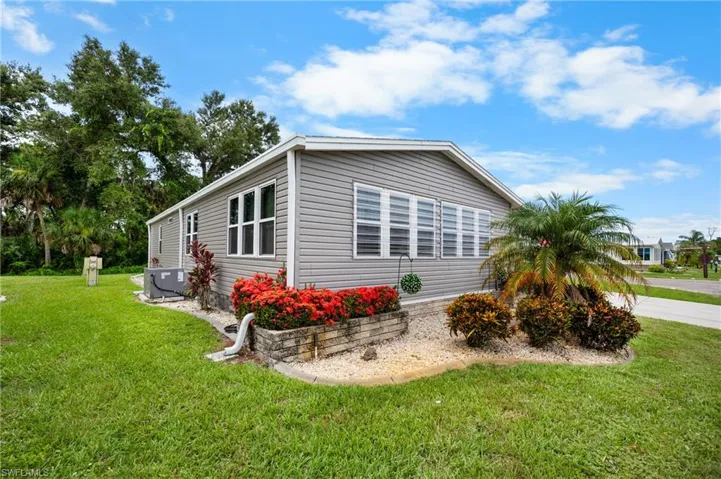 View of home's exterior with a lawn