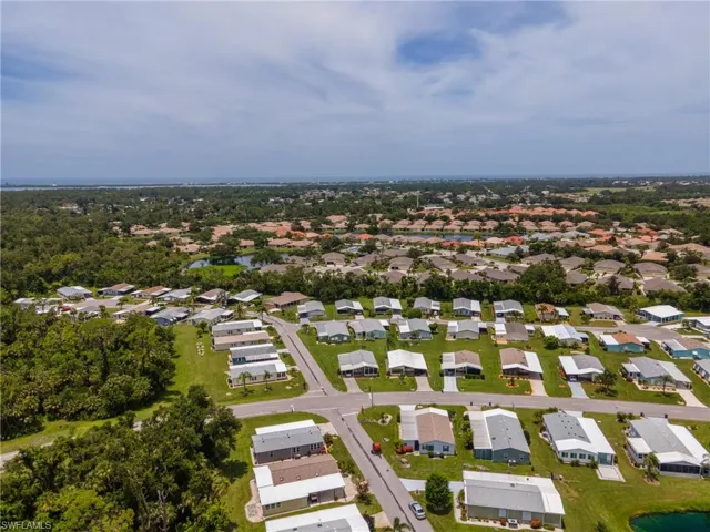 View of property location featuring nearby suburban area and a nearby body of water
