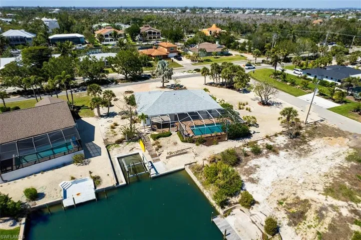 Aerial perspective of suburban area with a large body of water