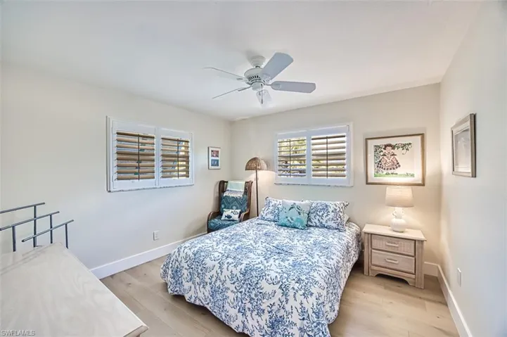 Bedroom with light wood-type flooring and ceiling fan