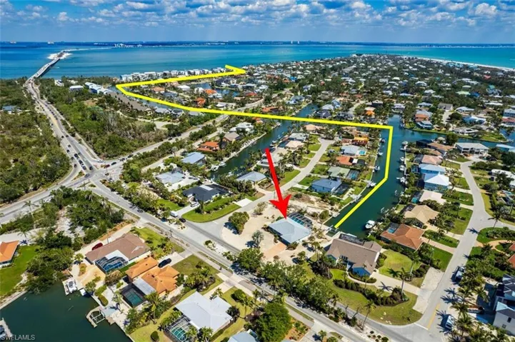 View of property location with a large body of water and nearby suburban area