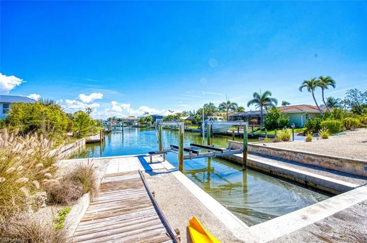 Dock featuring a water view and boat lift