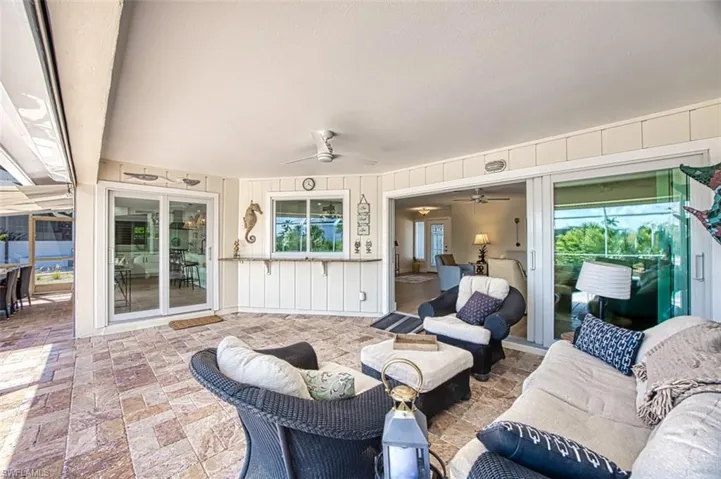 View of patio / terrace with ceiling fan and an outdoor living space