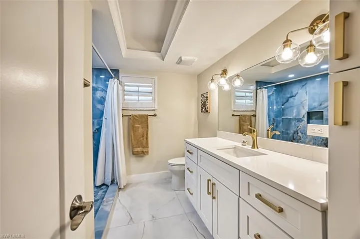 Bathroom with vanity and a shower with curtain