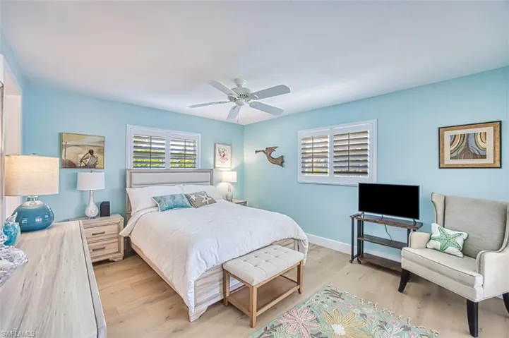 Bedroom featuring light wood-style floors and a ceiling fan