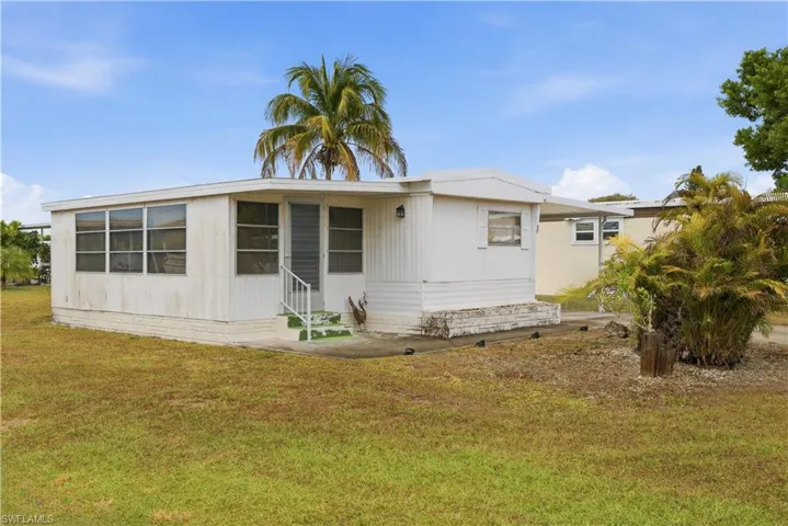 View of front of home featuring a front yard and entry steps