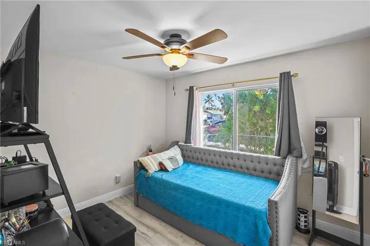 Bedroom featuring light wood-style floors and a ceiling fan