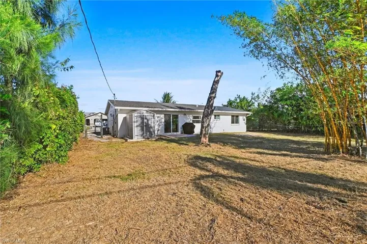 Rear view of property featuring stucco siding