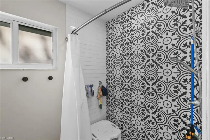 Bathroom featuring a shower stall
