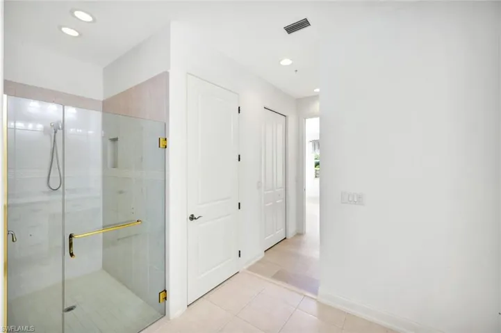 Framless glass walk-in shower and private water closet