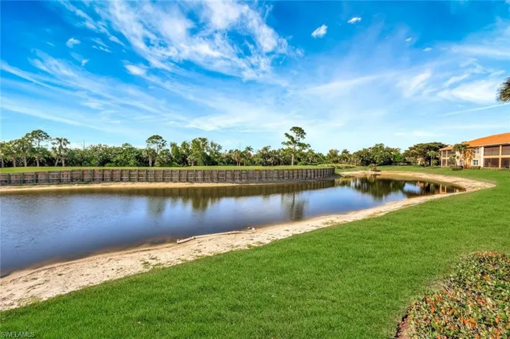 Step outside your screened lanai for unobstructed water and golf course views