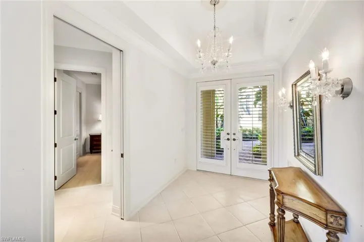 Inviting Foyer with chandelier and ceiling detail