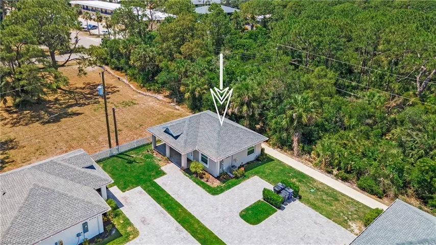 Contemporary single-story residence with a gray shingle roof