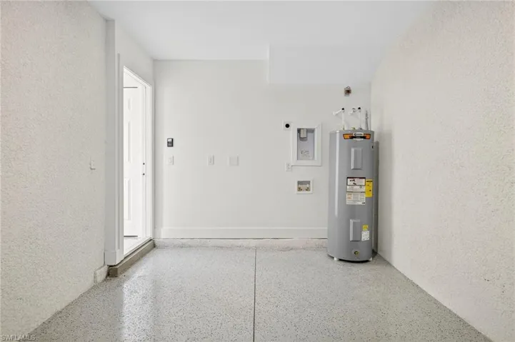 Utility room with electric water heater