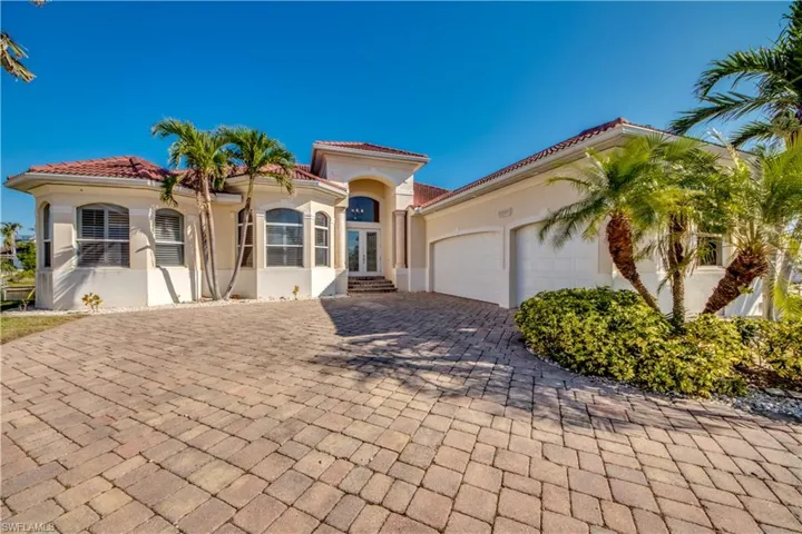 Mediterranean / spanish-style home featuring a garage
