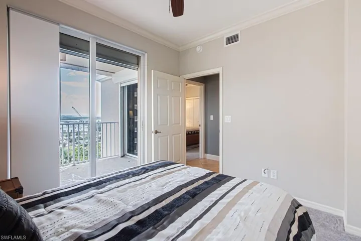 Bedroom featuring crown molding, access to outside, a ceiling fan, and light carpet