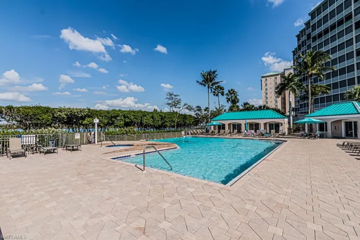 Community pool with a patio and a community hot tub