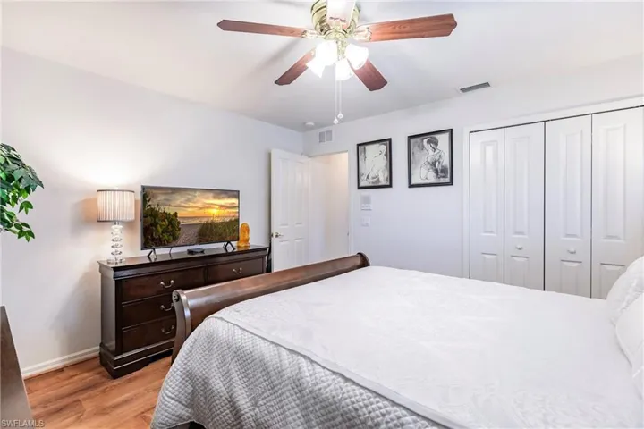 Bedroom featuring a closet, ceiling fan, and light hardwood / wood-style floors