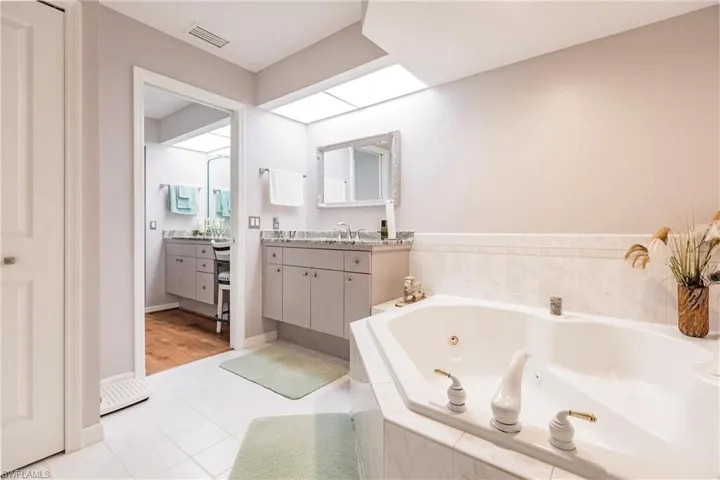 Bathroom featuring tile flooring and vanity