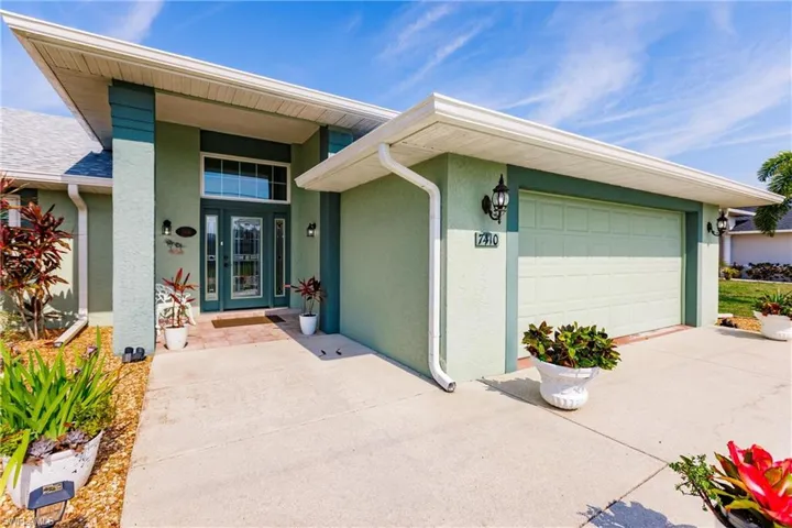 View of exterior entry featuring a garage