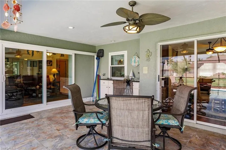 View of patio featuring ceiling fan