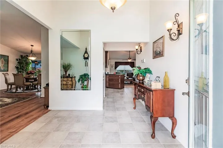 Tiled entrance foyer featuring ceiling fan