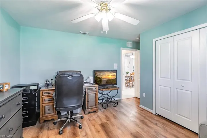 Office area featuring ceiling fan and light hardwood / wood-style flooring