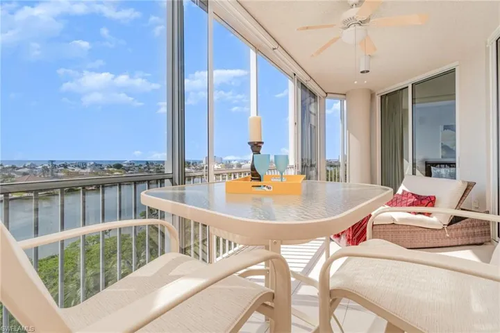 GULF AND LAGOON VIEWS FROM THE ROOMY SOUTHWEST LANAI.  SLIDING DOOR AT REAR LEADS TO OWNER'S SUITE. ENTRANCE TO LIVING AREA IS TO RIGHT.