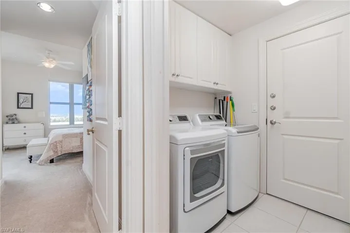 SPACIOUS LAUNDRY WITH LOTS OF CABINETS