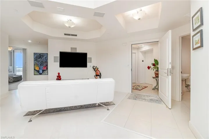 MAIN LIVING AREA. UNIT ENTRANCE AND PRIVATE ELEVATOR LOBBY.  GUEST BATH SHOWN AT RIGHT.  ENTRANCE TO GUEST BEDROOM 1 SHOWN AT LEFT.
