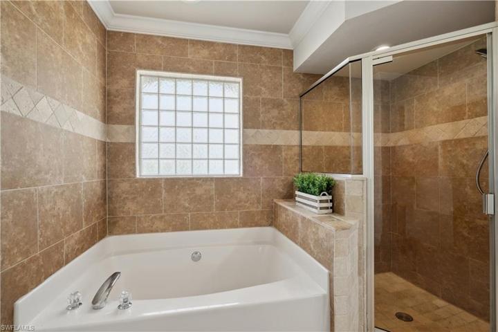 Shower & Soaking Tub in owner's suite