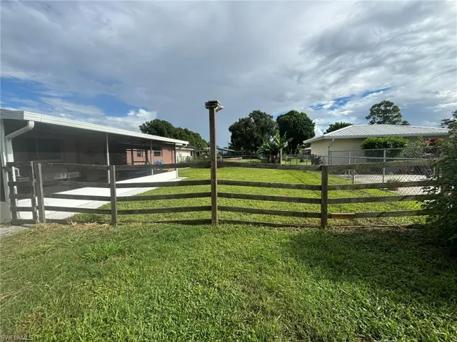 View of yard featuring a sunroom