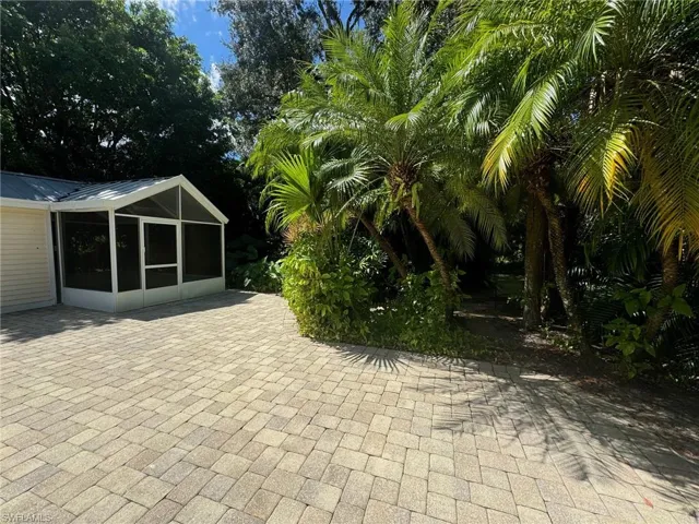 View of patio / terrace featuring a sunroom