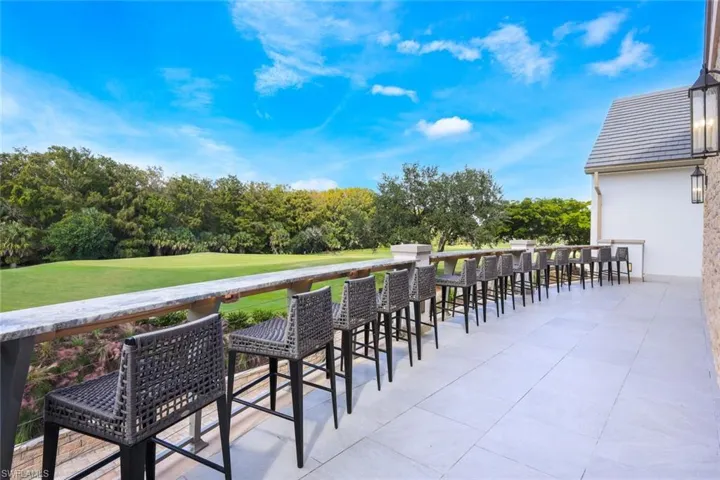 Wooden deck featuring a patio and a yard