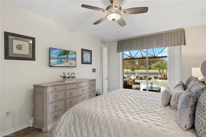 Bedroom featuring ceiling fan, access to exterior, and light wood-type flooring