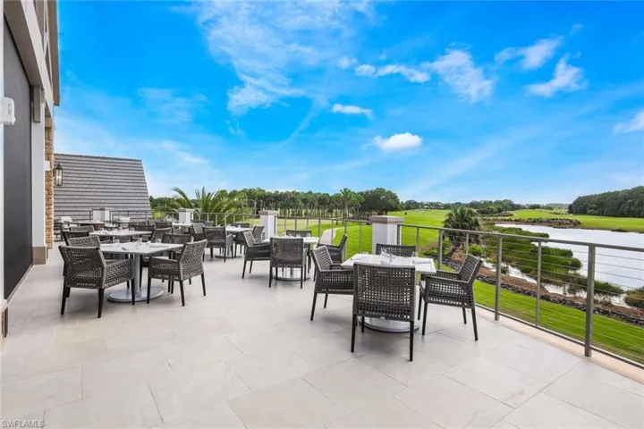 View of patio with a balcony
