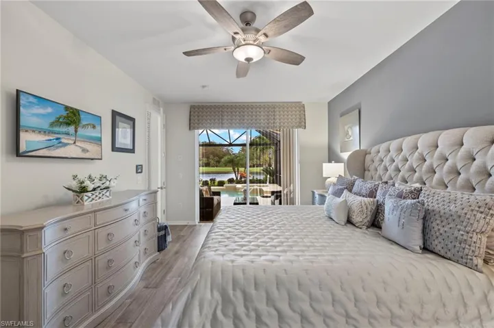 Bedroom with ceiling fan, light hardwood / wood-style flooring, and access to outside