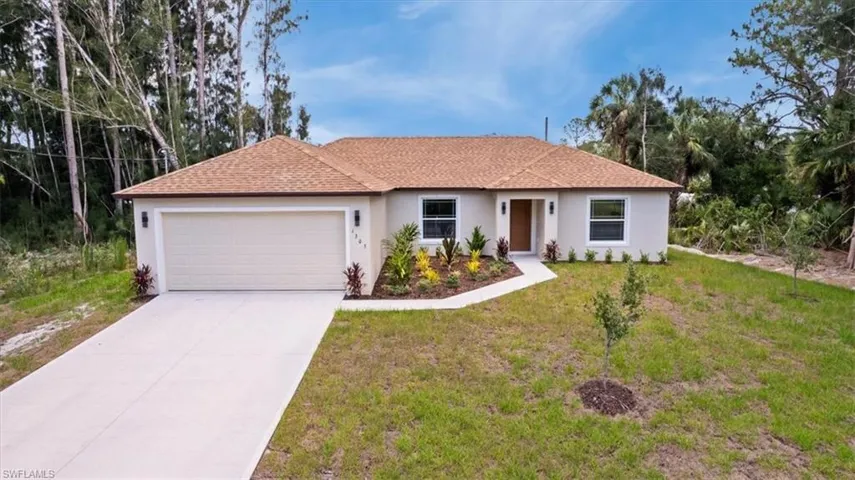Single story home with stucco siding, a garage, driveway, a front lawn, and a shingled roof