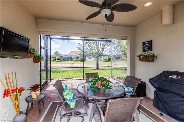 Sunroom featuring a ceiling fan