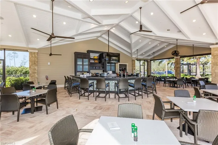 Dining space with plenty of natural light, high vaulted ceiling, ceiling fan, and beamed ceiling