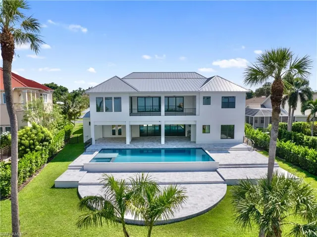 View of pool featuring a patio and a lawn