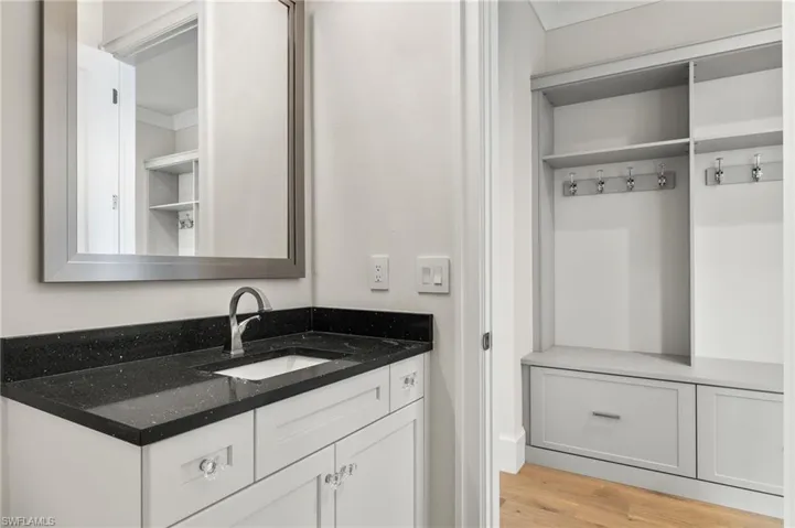 Bathroom with vanity and hardwood / wood-style flooring