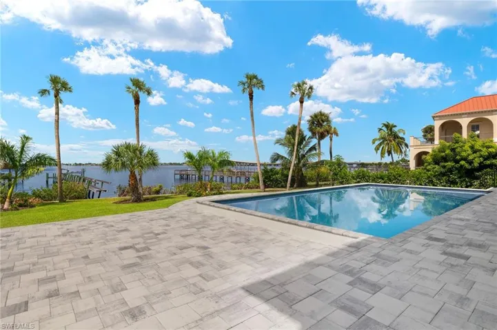 View of swimming pool featuring a yard and a patio