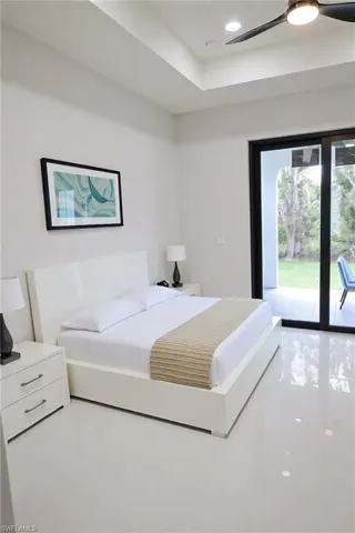 Bedroom featuring access to exterior and recessed lighting