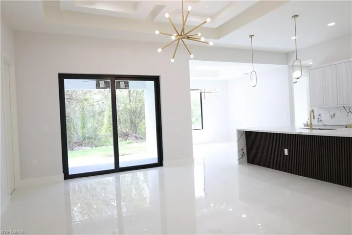 Unfurnished living room with a sink and recessed lighting