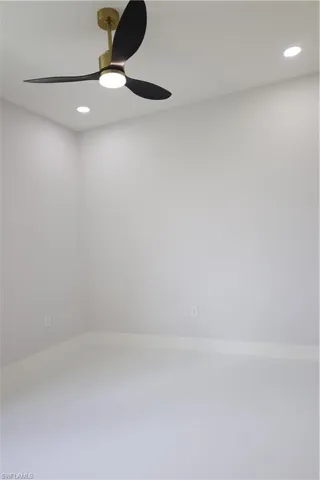 Empty room with recessed lighting and ceiling fan