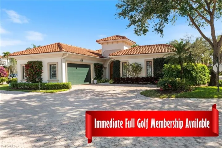 View of front of property with a garage, a tiled roof, decorative driveway, and stucco siding