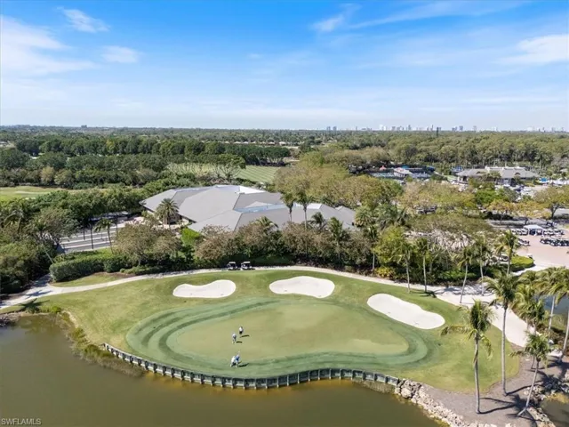 Drone / aerial view featuring view of golf course and a water view