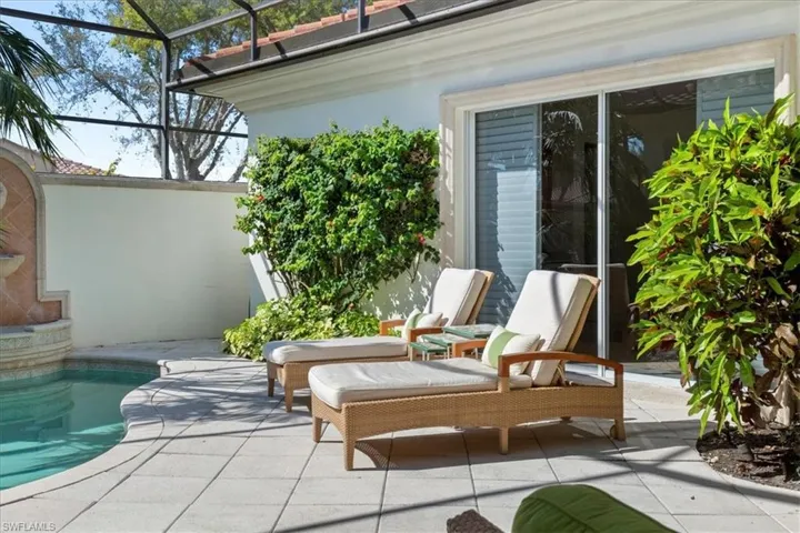 View of patio / terrace featuring a lanai and an outdoor pool